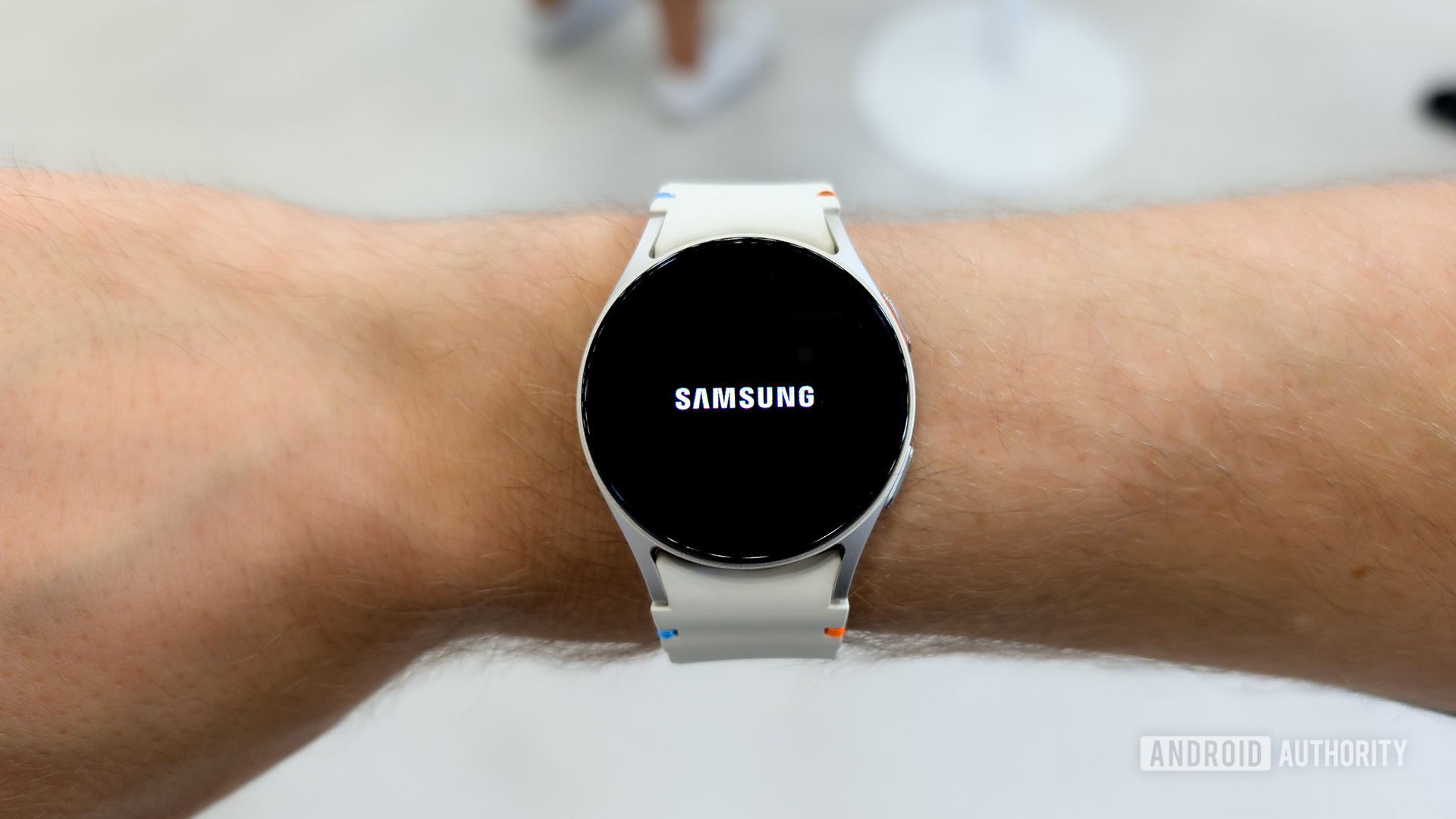 Samsung Galaxy Watch 7 on male Wrist A Samsung Galaxy Watch on a male wrist displays the Samsung logo.
