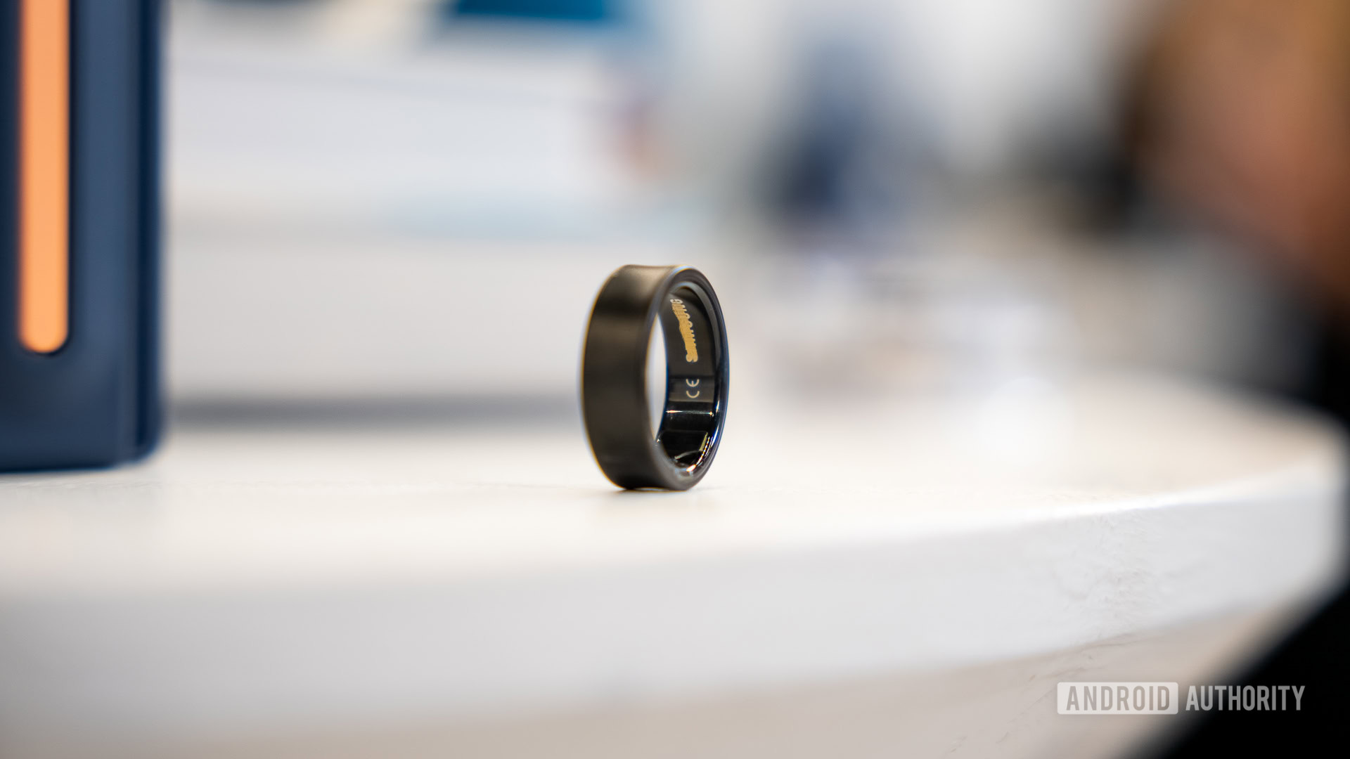 Samsung Galaxy Ring 6 A Samsung Galaxy Ring in a Black Titanium finish rests on a table.