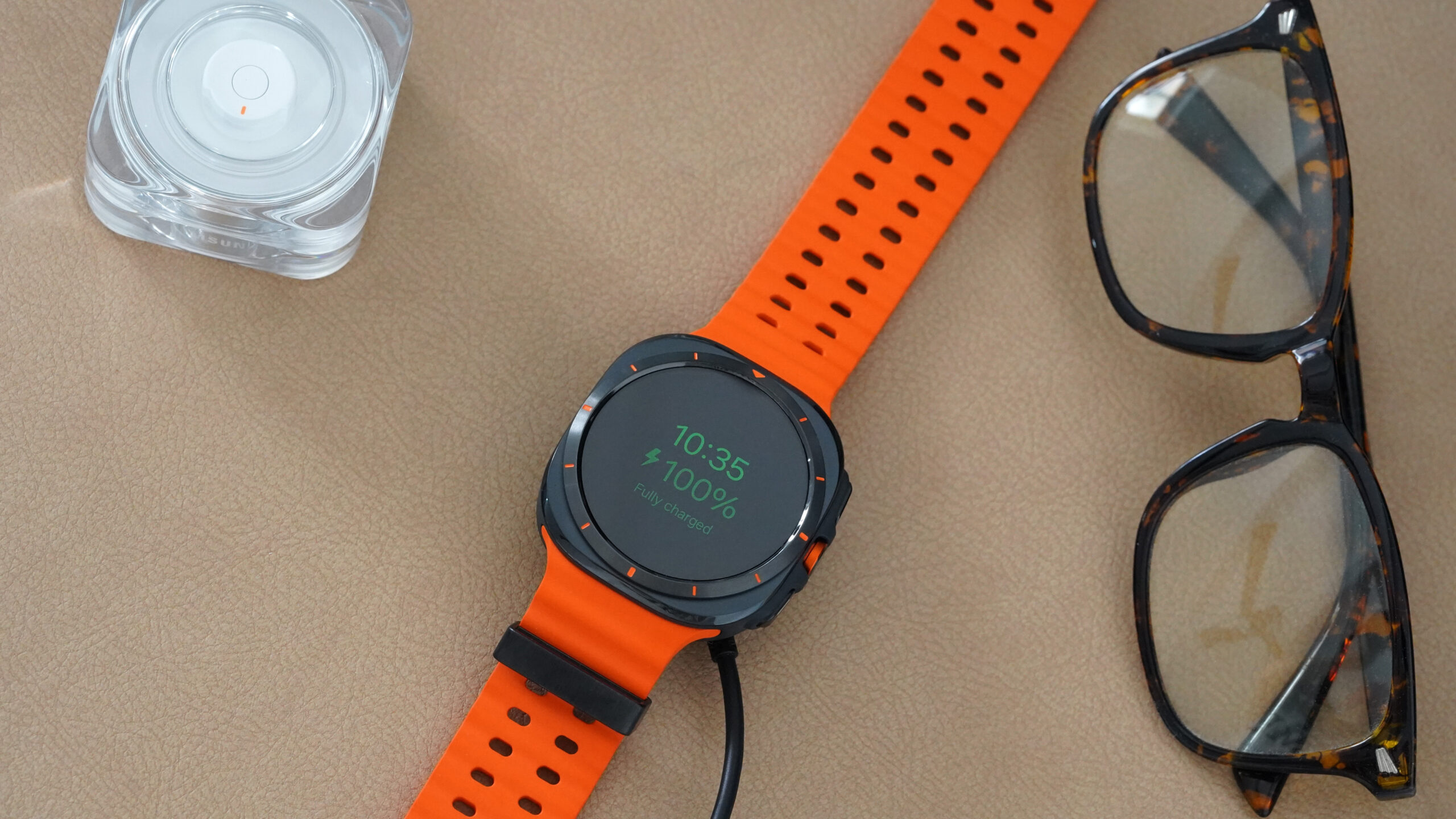 Samsung Galaxy Watch Ultra Charging A Samsung Galaxy Watch Ultra charges to 100% while its user wears the Galaxy Ring instead.
