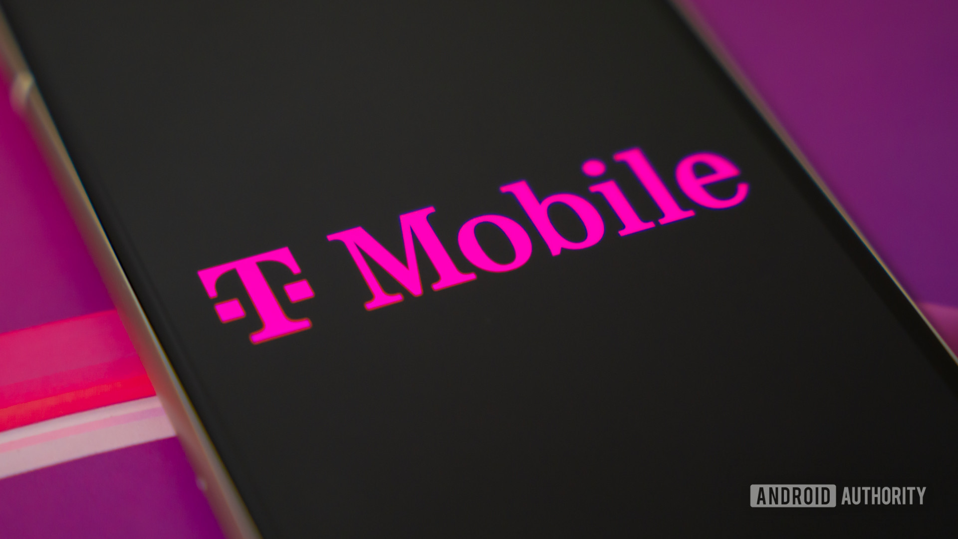 T Mobile logo on smartphone (2) T Mobile logo on smartphone (2)