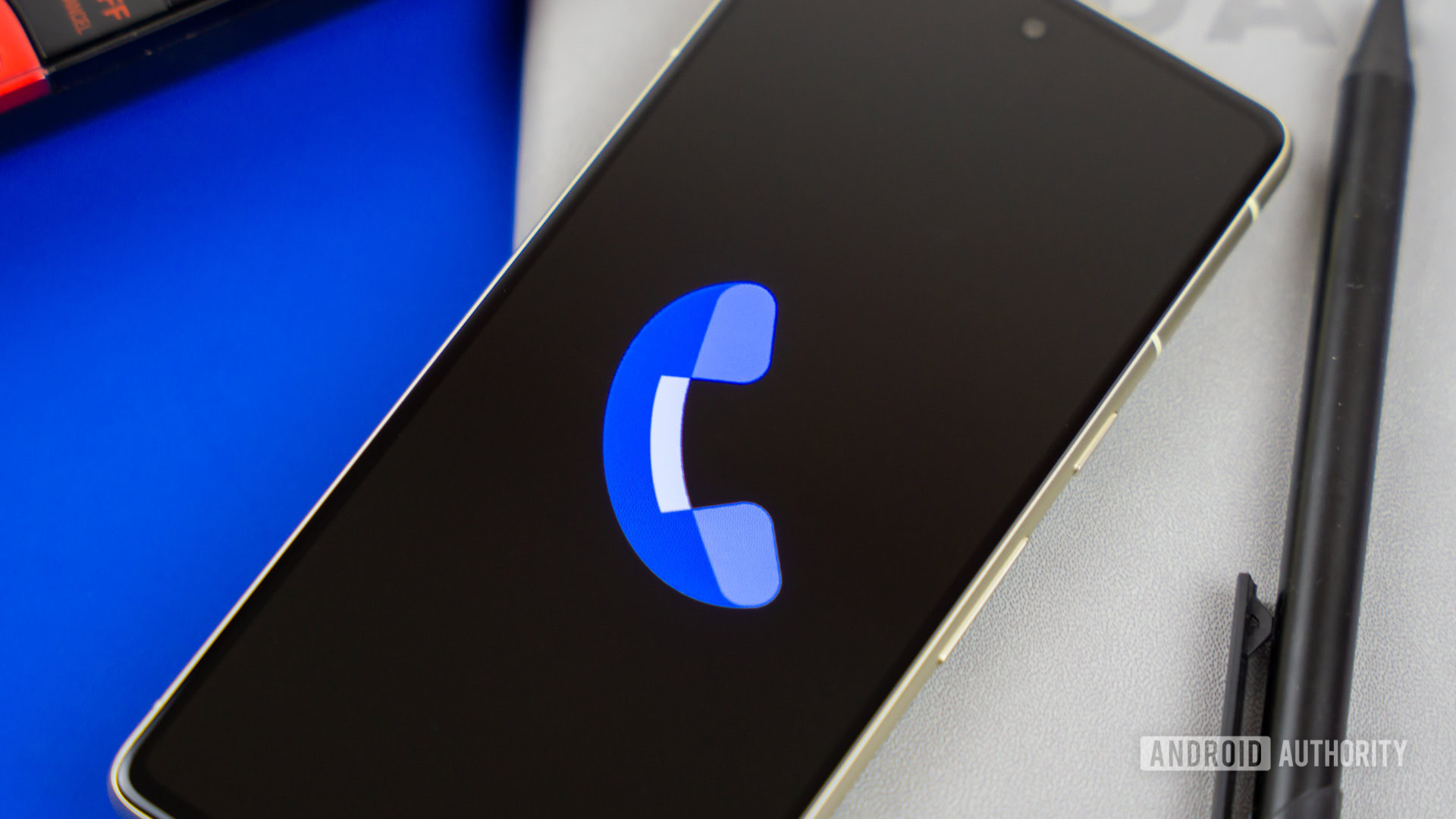 Stock photo of Phone by Google app on phone next to home phone agenda and pen 2 Stock photo of Phone by Google app on phone next to home phone agenda and pen 2