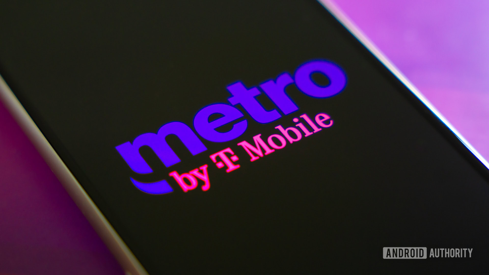 Metro by T Mobile logo on smartphone Metro by T Mobile logo on smartphone