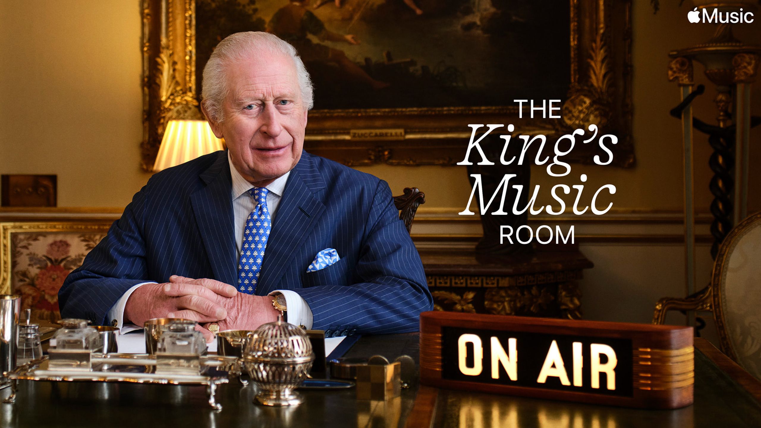 King Charles sitting at his desk to promote The King's Music Room.
