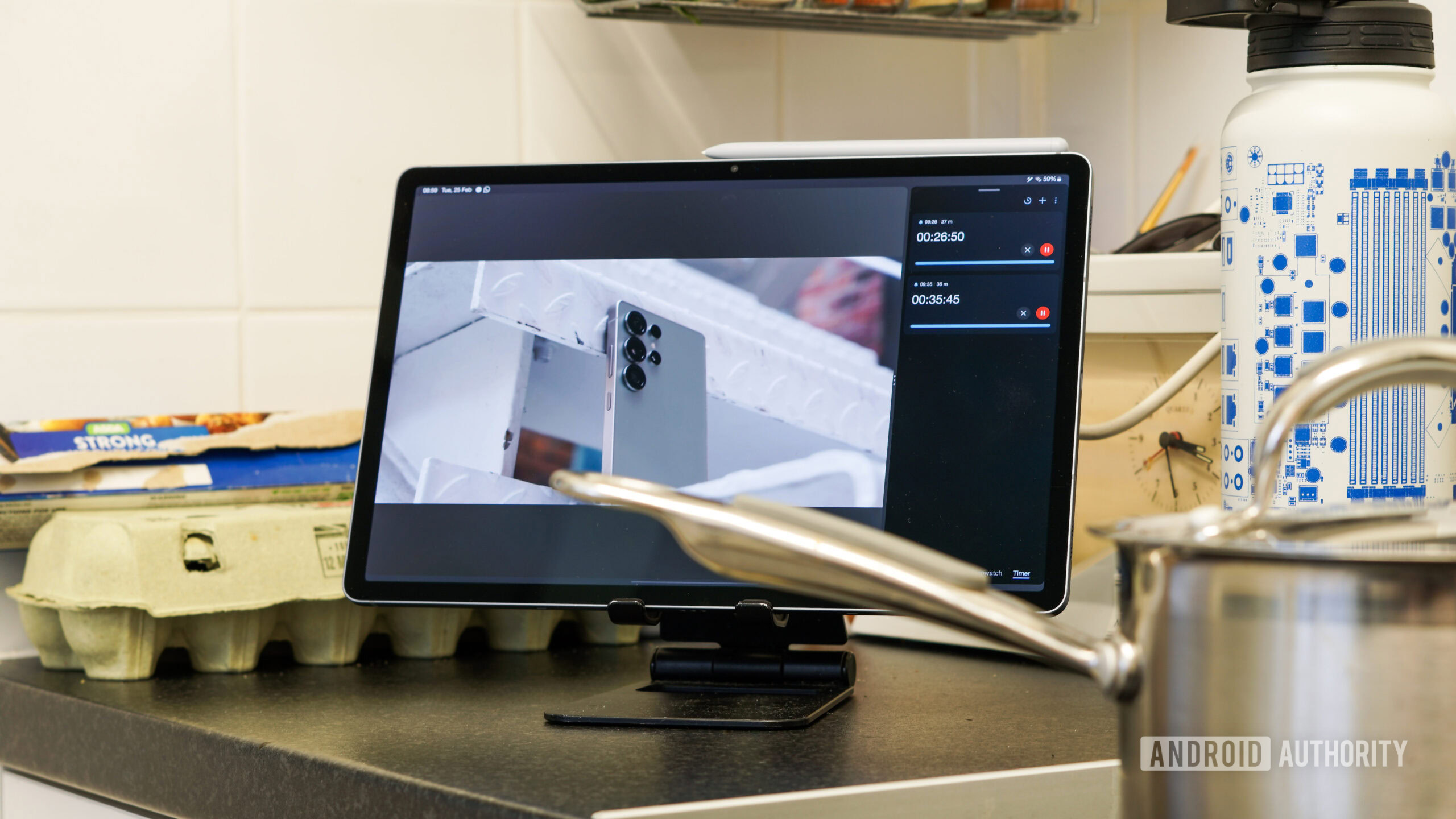 Galaxy Tab S10 Plus lifestyle A photo of a Galaxy Tab S10 Plus being used in a kitchen, running timers and playing video