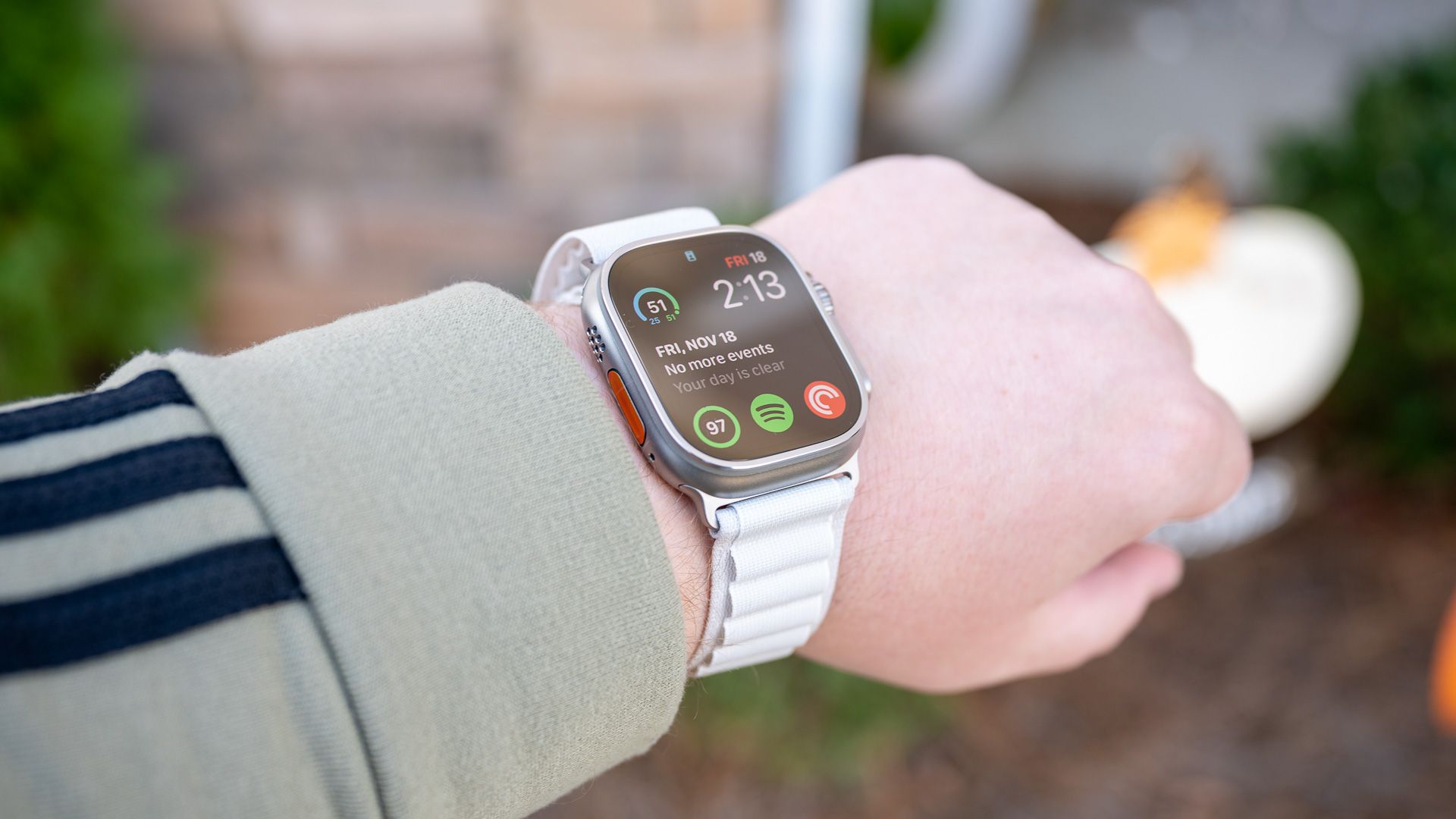 Person wearing the Apple Watch Ultra with the Ocean Band watch band.