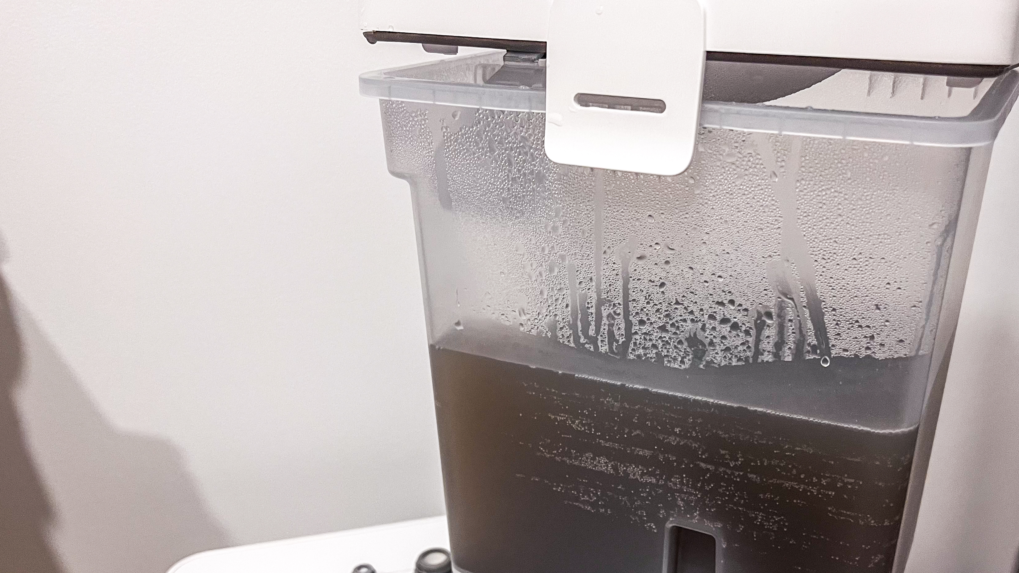 A half-full dirty-water tank on the Roborock Qrevo Edge dock