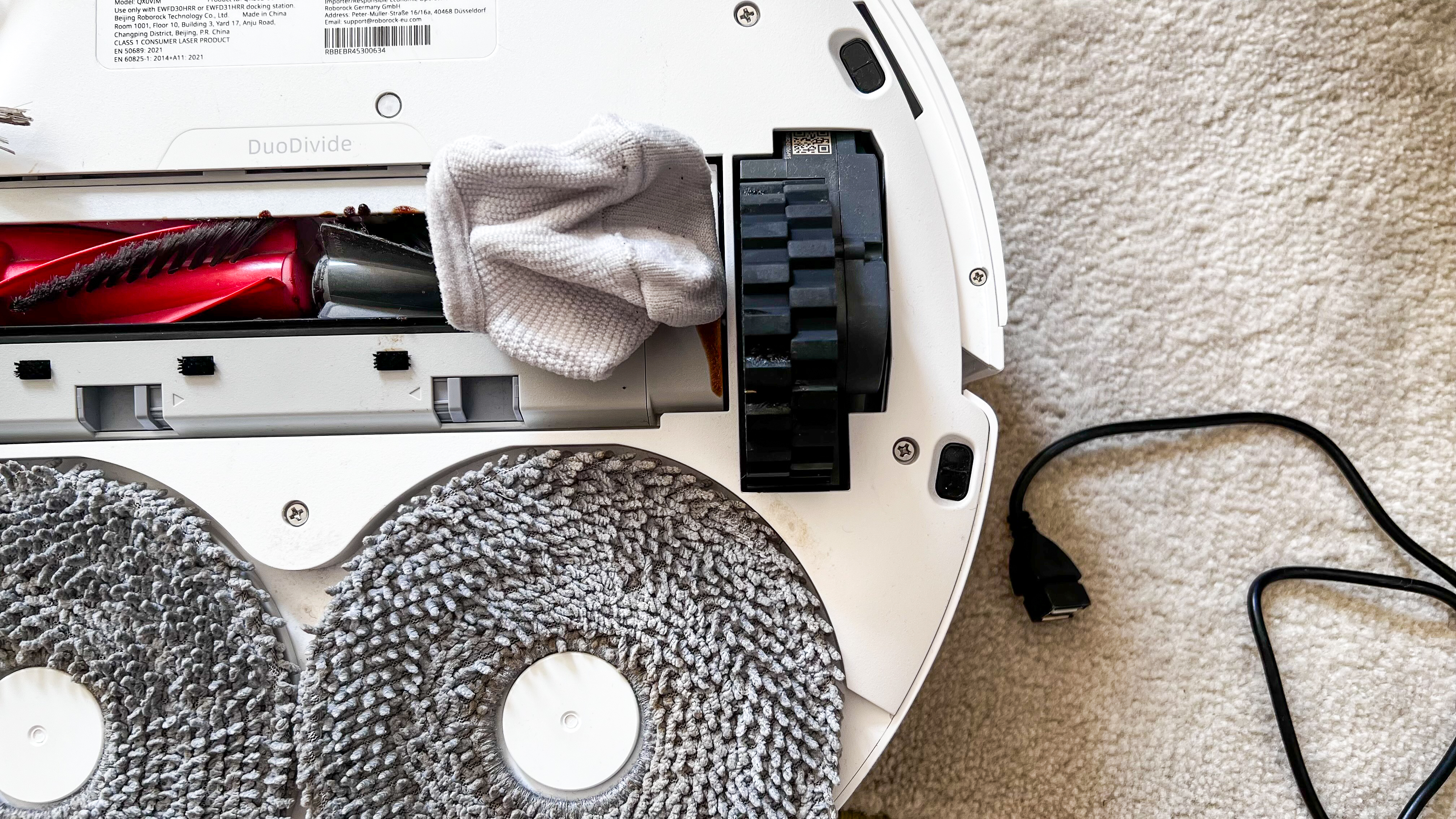 A sock stuck in the central brush of the Roborock Qrevo Edge
