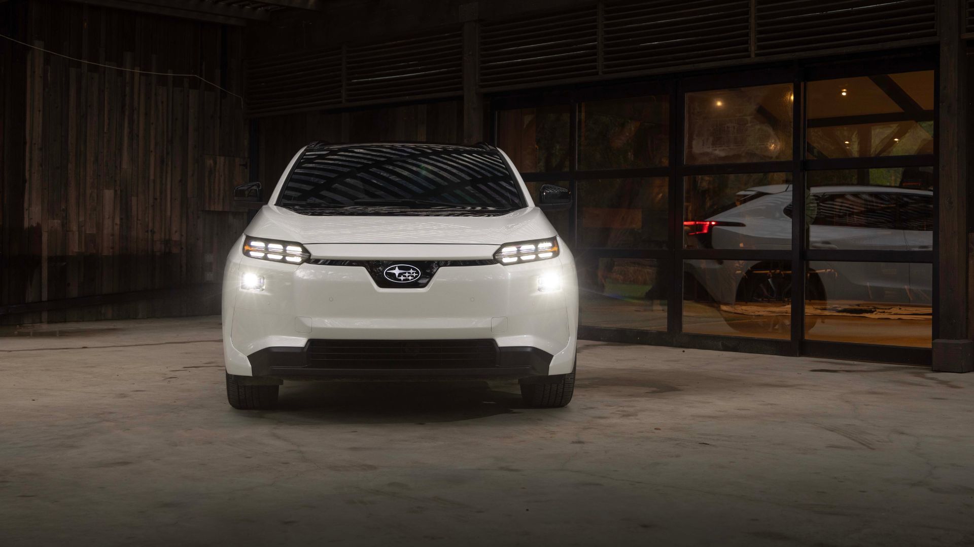 Front-end shot of the 2026 Subaru Solterra parked indoors.