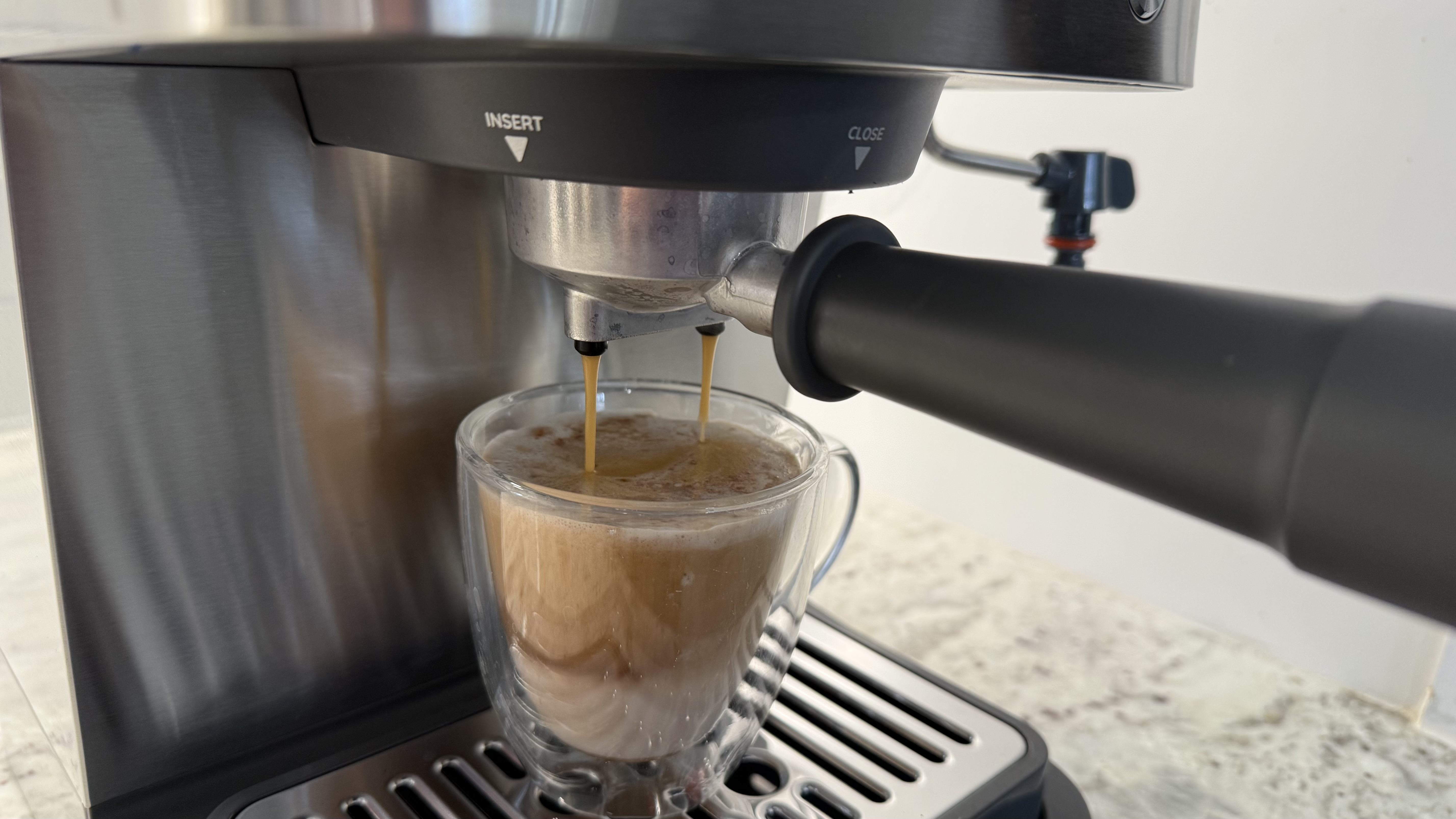 De'Longhi Linea Classic Espresso Machine brewing cappuccino