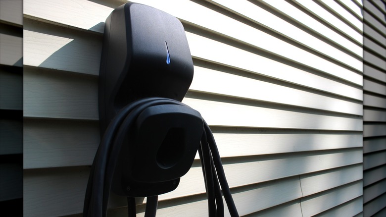 A Level 2 EV Charging Station is mounted on a home exterior