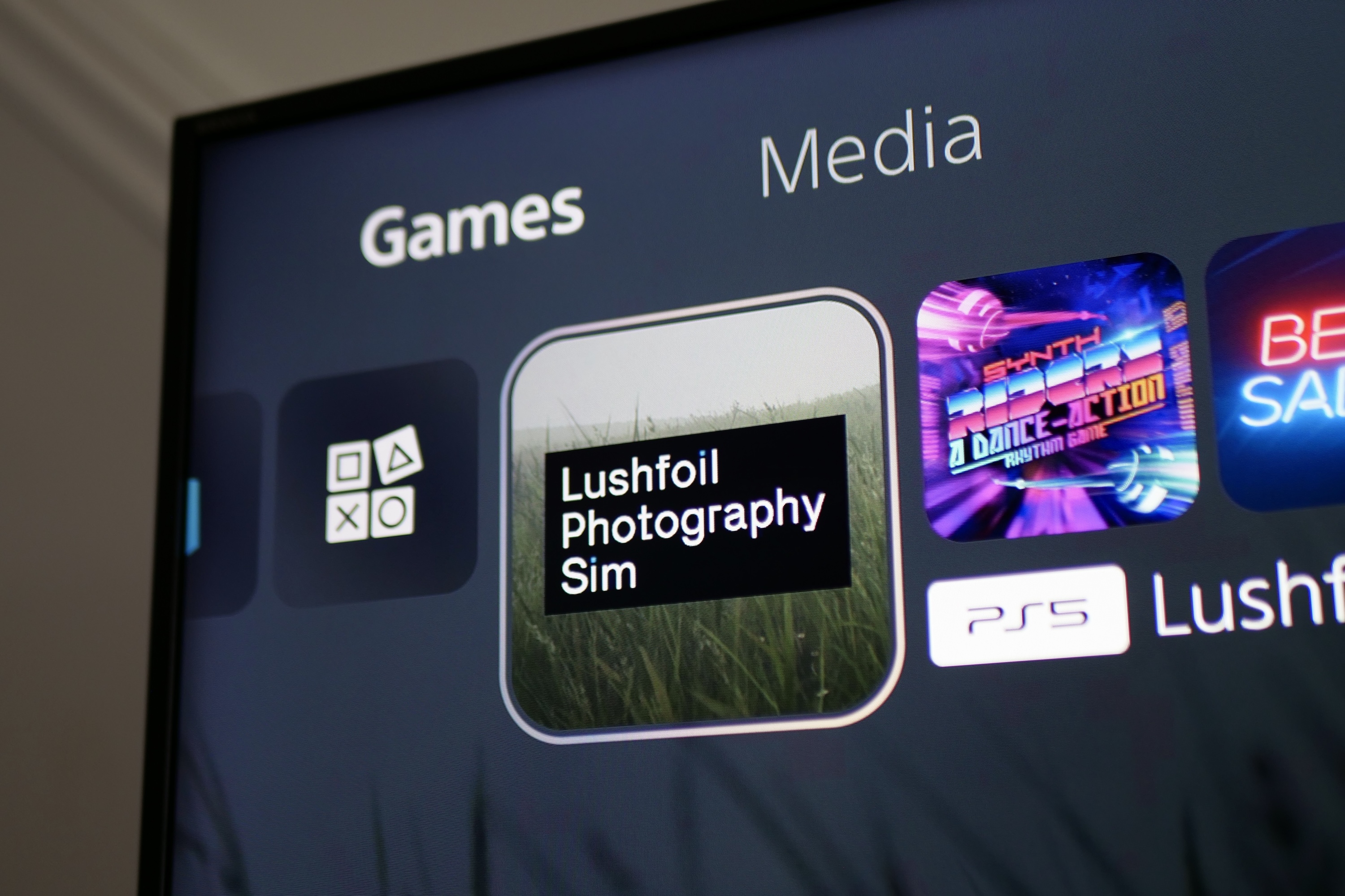 The icon for the Lushfoil Photography Sim game on PS5.