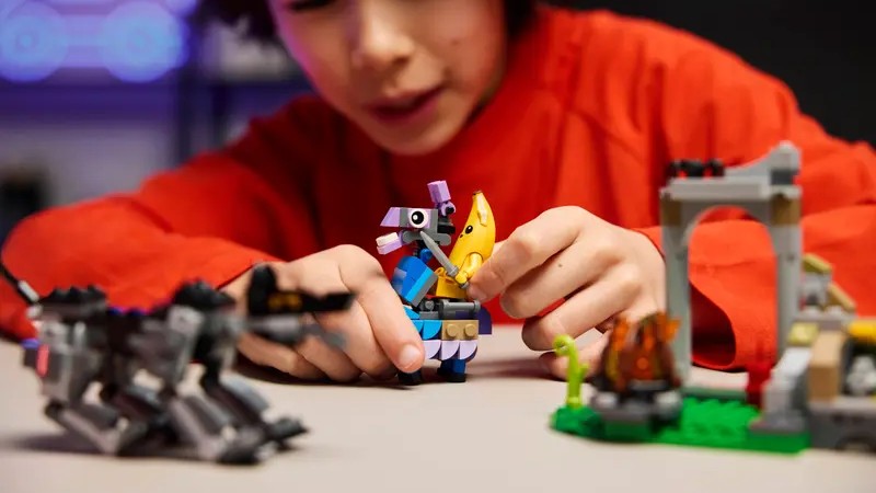 A kid playing with a Lego Supply Llama