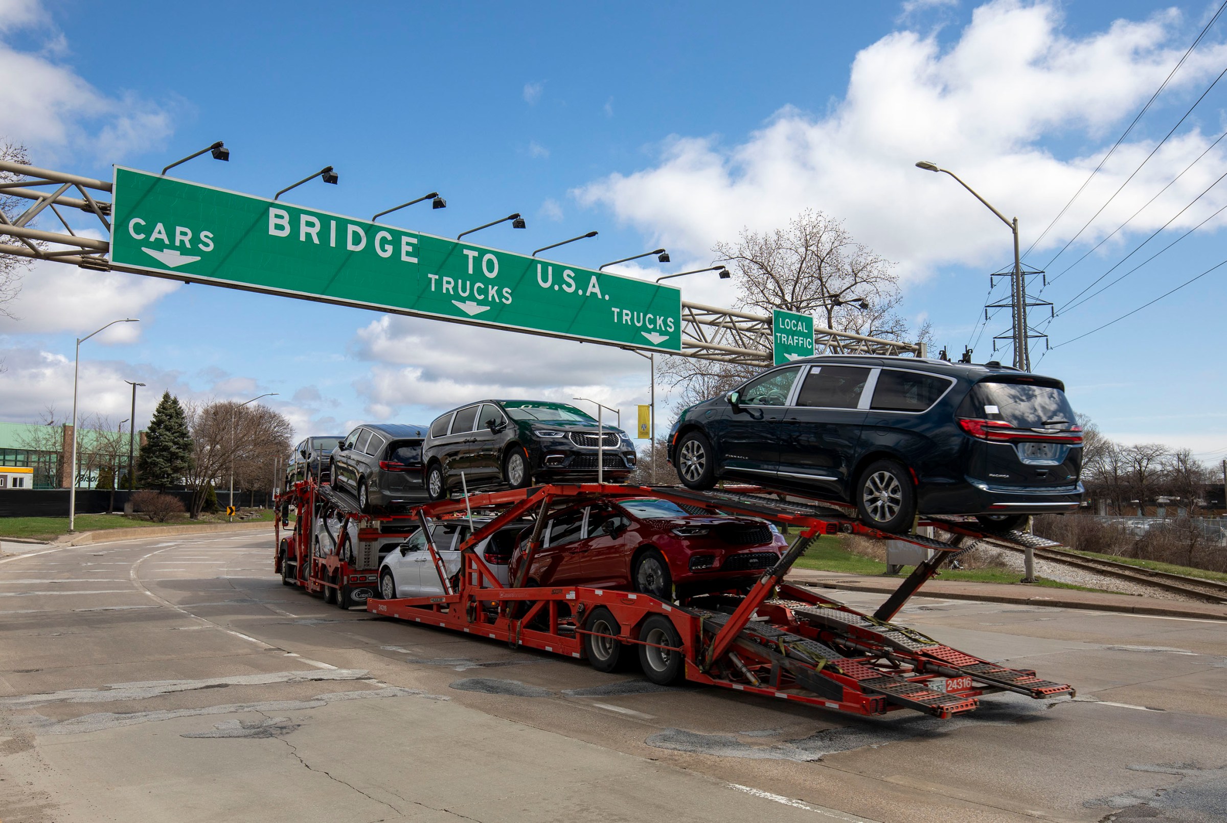 A car hauler truck makes its way to the Ambassador Bridge to cross into the United States on April 1st, 2025, in Windsor, Canada.