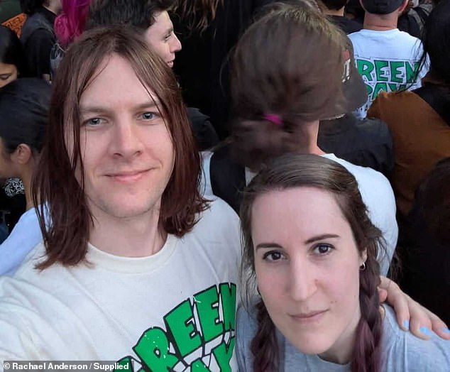 Wildlife carer Rachael Anderson (right) and her partner Sam (left) were part of a group in Adelaide's city centre trying to rescue small tree martins which had smashed into a window