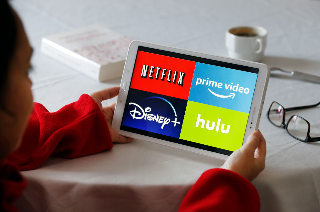 Various streaming service logos displayed on a tablet.