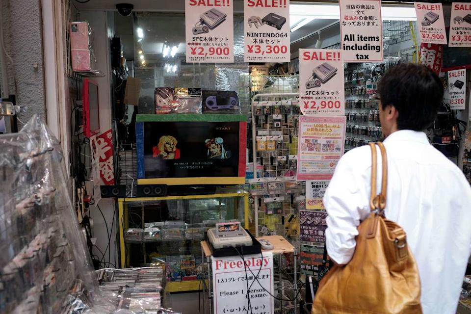 Best Video Game Store - Woman Outside Store