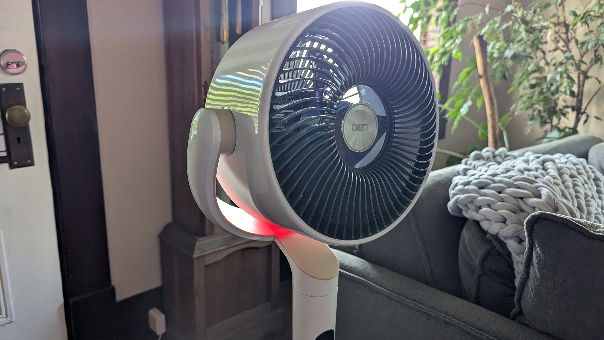 Close up of fan head on Dreo TurboPoly Fan 508S, showing red ambient lighting