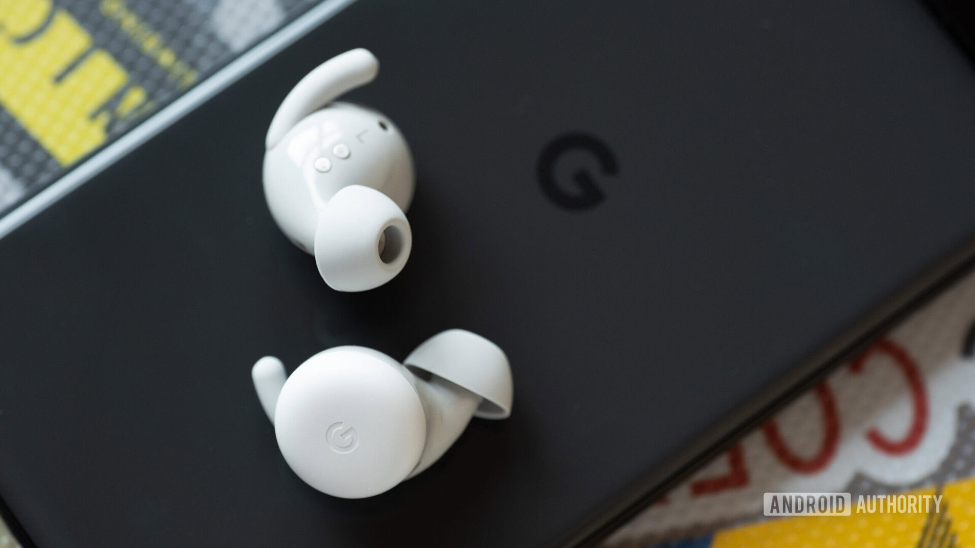 Google Pixel Buds A Series earbuds ear tips wings The Google Pixel Buds A-Series earbuds on a Pixel 6 phone.