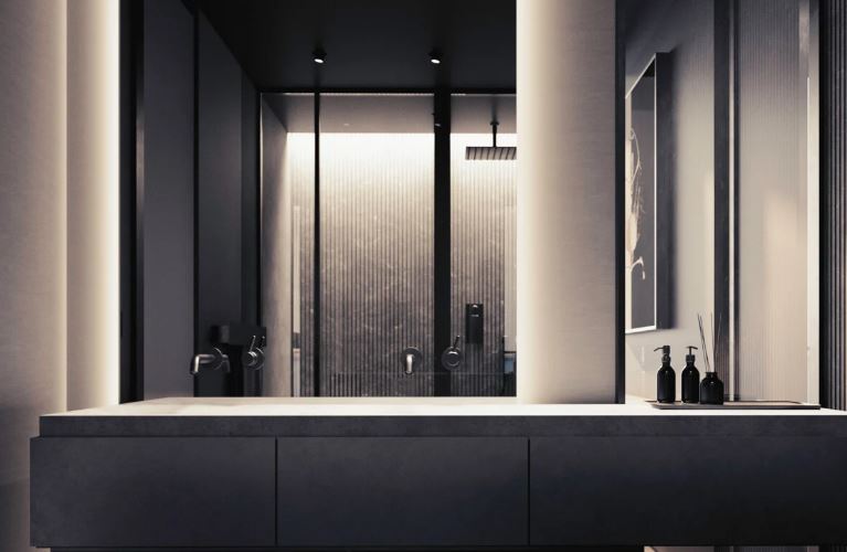 Modern bathroom vanity with a mirror reflecting a shower.