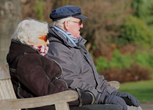 a couple sitting in St James' Park, London.