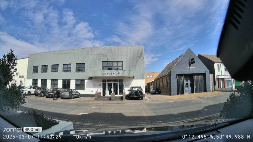 Screenshot from main camera when first set up, showing a city road from a driveway