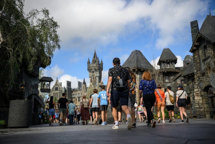Guests walk through the Dark Universe area at the Epic Universe theme park in Orlando, Florida