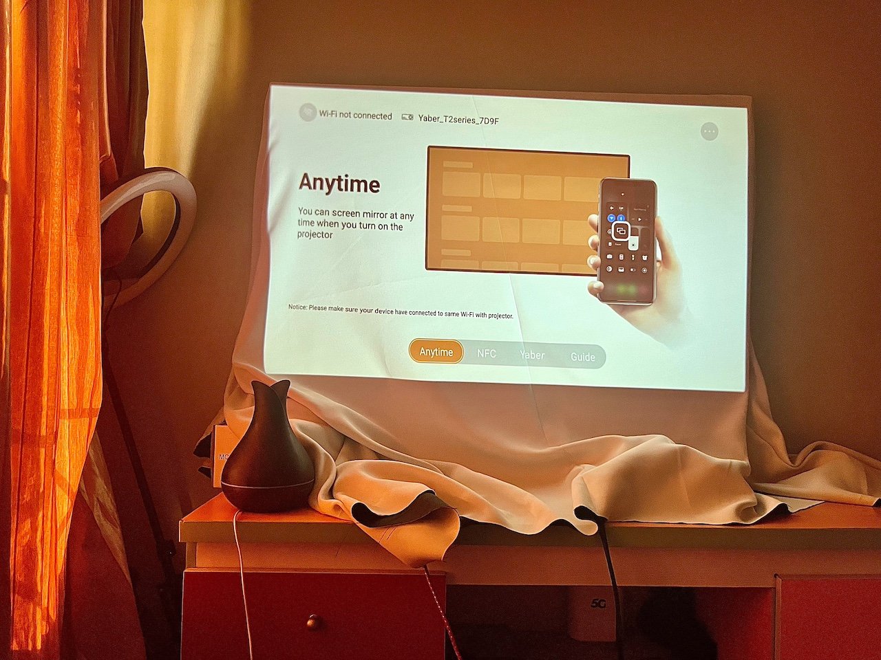 Projected image showing instructions for casting phone content