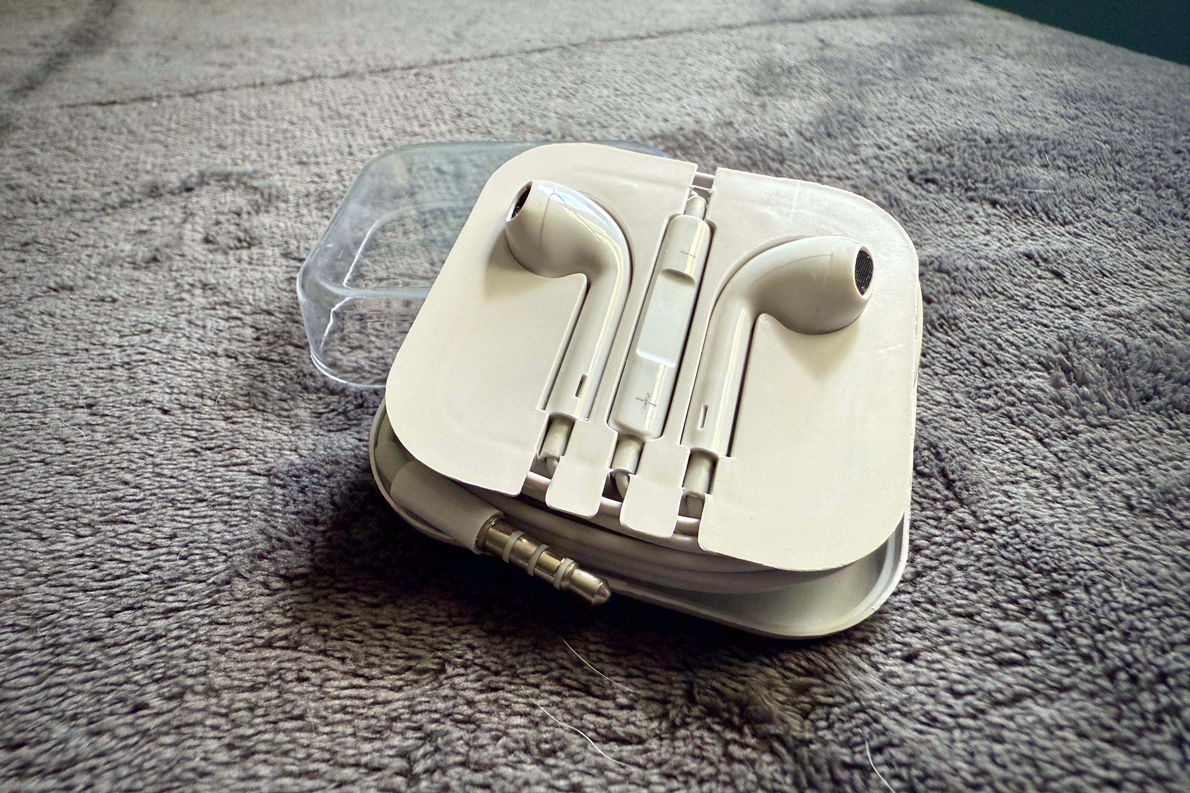 Apple AirPods in their original case.
