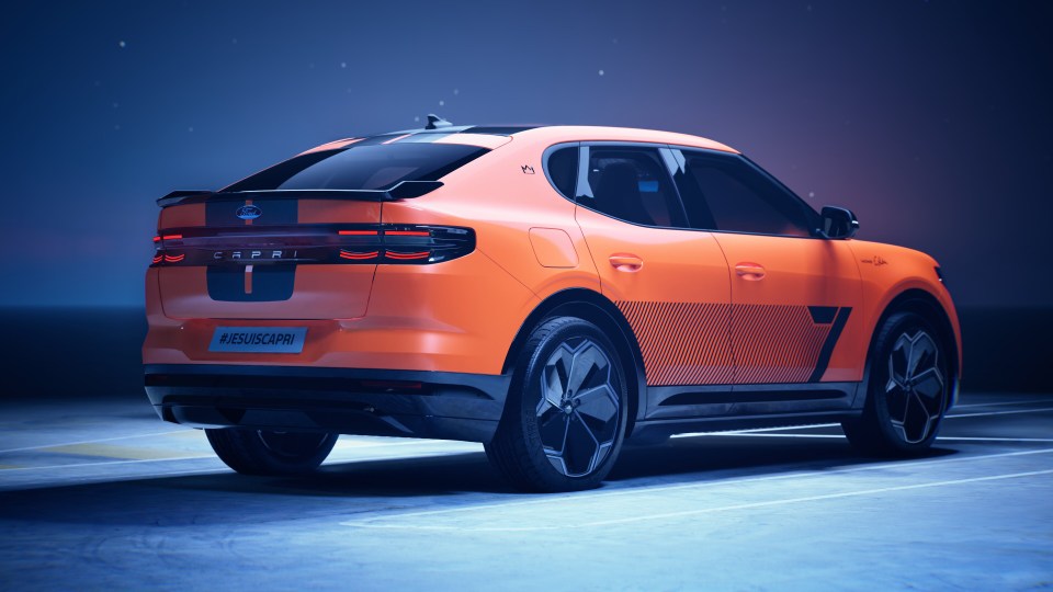 Rear view of an orange Eric Cantona personalized Ford Capri.