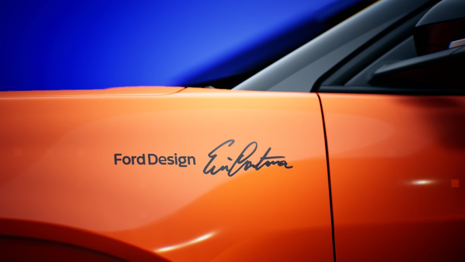 Eric Cantona's signature on an orange Ford Design car.
