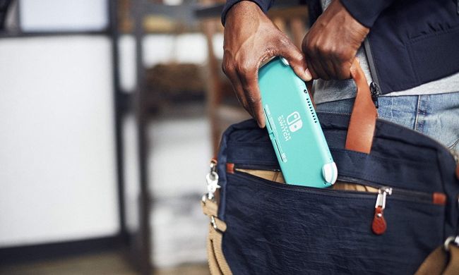 Person placing Nintendo Switch Lite in bag