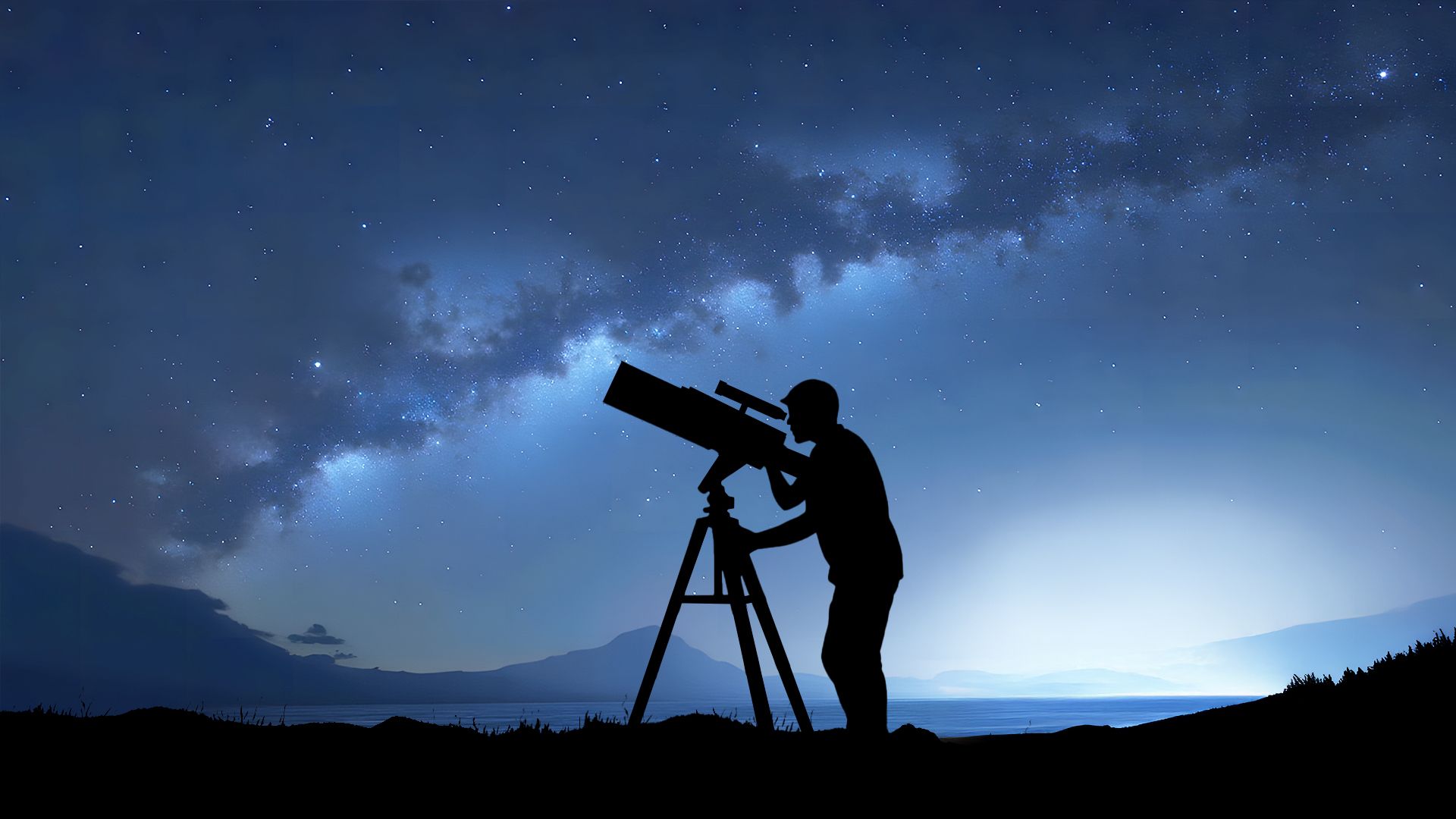Silhouette of a person stargazing using a telescope.