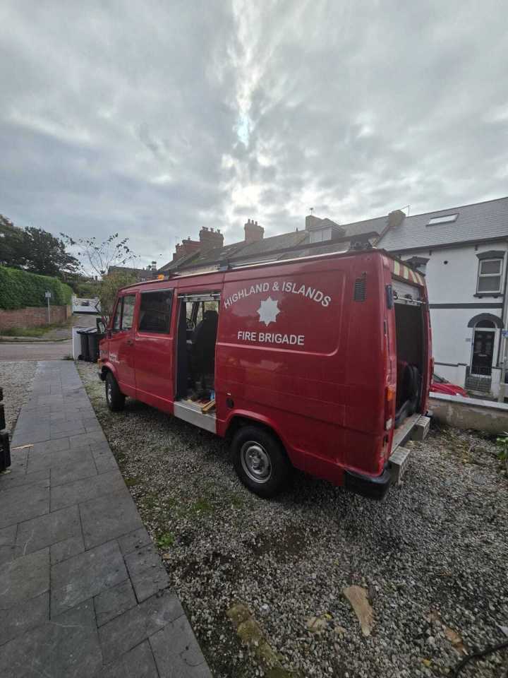 Red Highlands and Islands Fire Brigade van converted into a campervan.