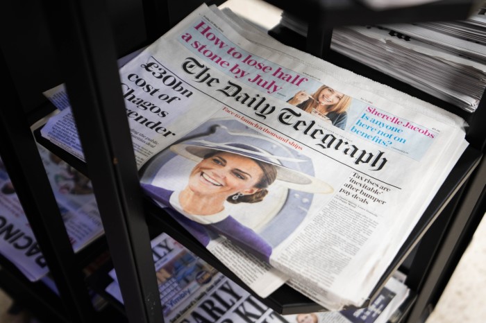 Copies of the Daily Telegraph newspaper on sale at a shop in Victoria