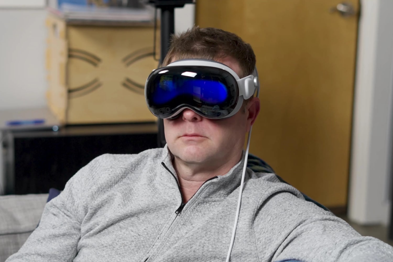 A man wears an Apple Vision Pro headset.