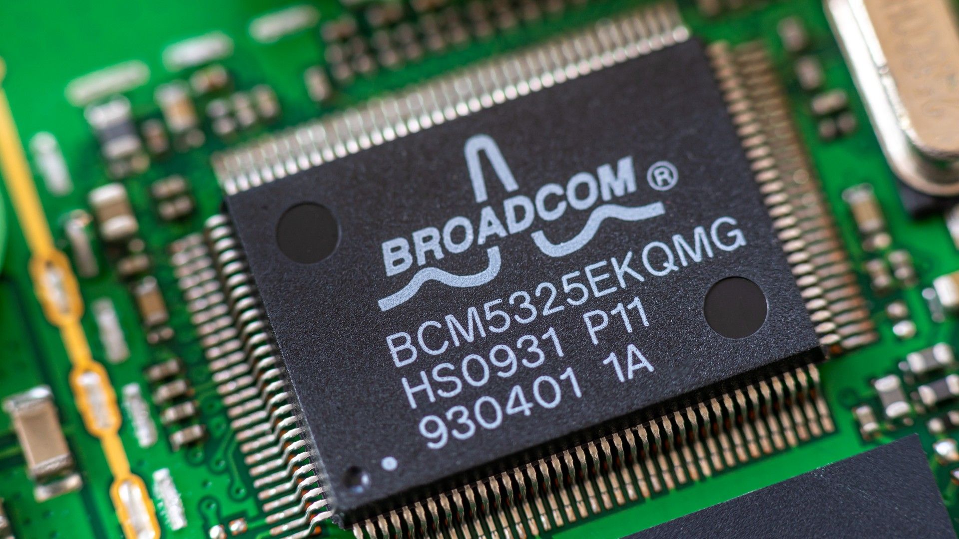 Closeup of a Broadcom chip on a computer board.