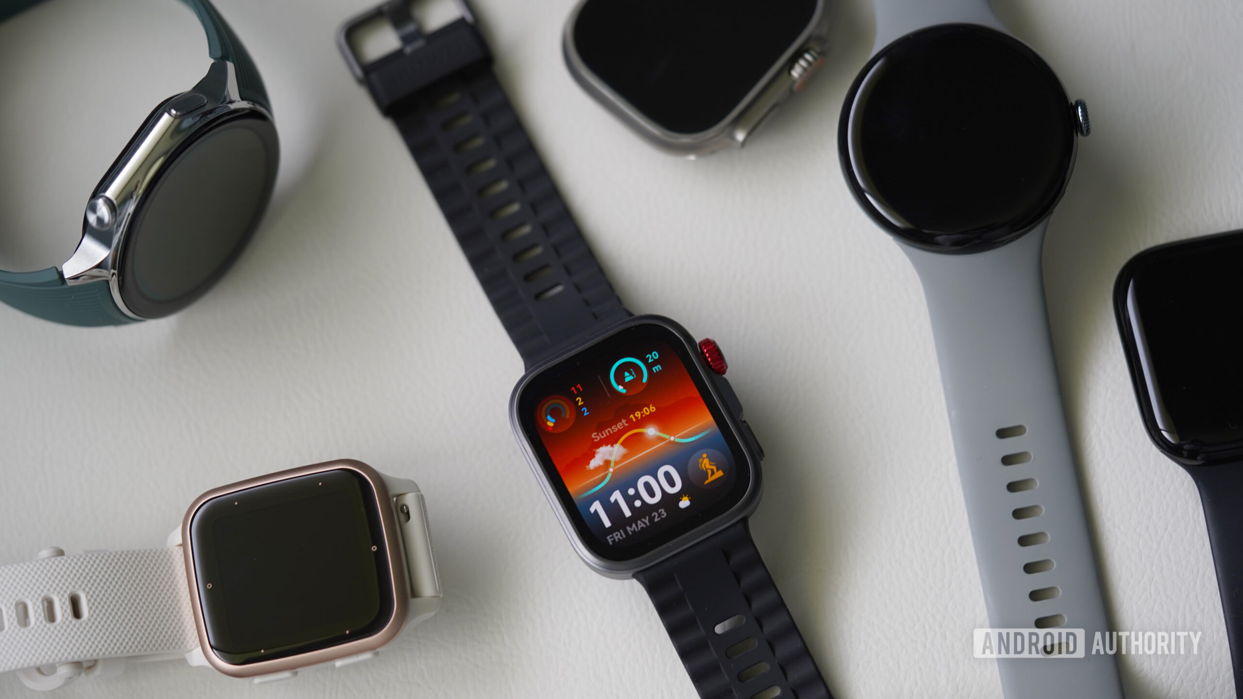 Huawei Watch Fit 4 Pro alternatives A Huawei Watch Fit 4 Pro rests on a white surface among alternatives.