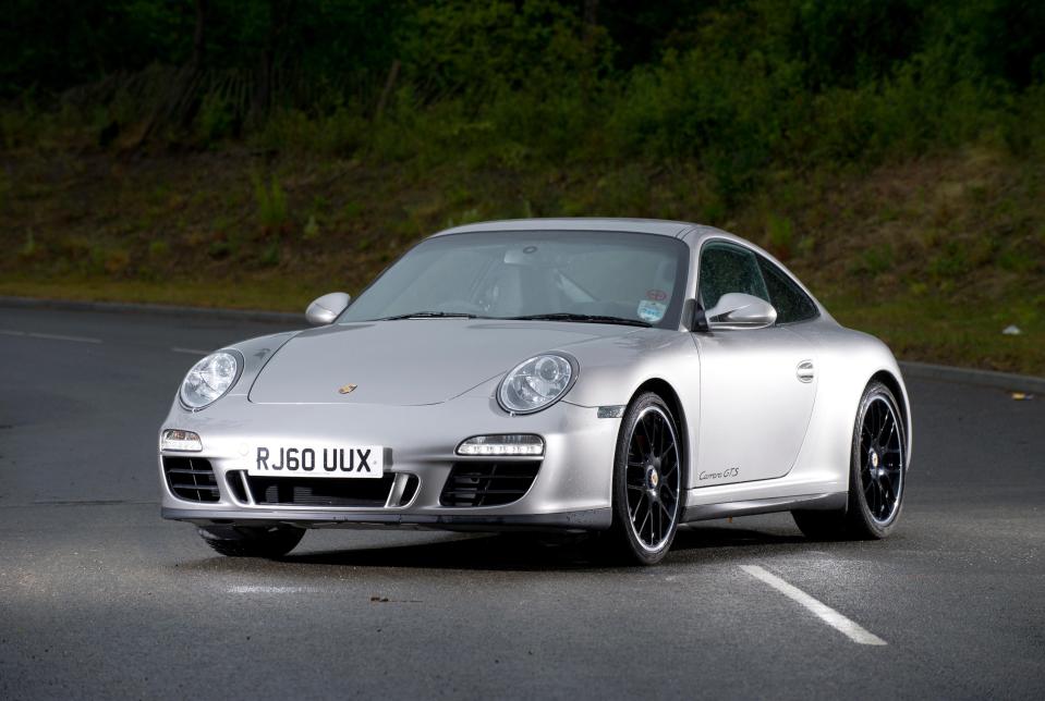 Silver Porsche 911 Carrera GTS sports car.