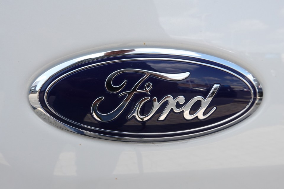 Ford logo on a white vehicle.