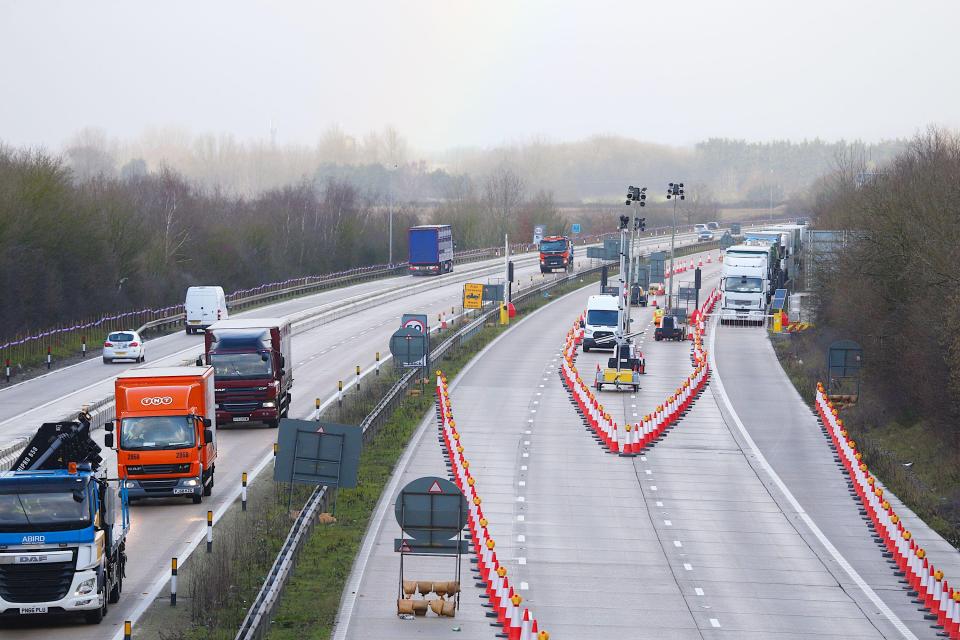 Lorries queuing on a motorway.
