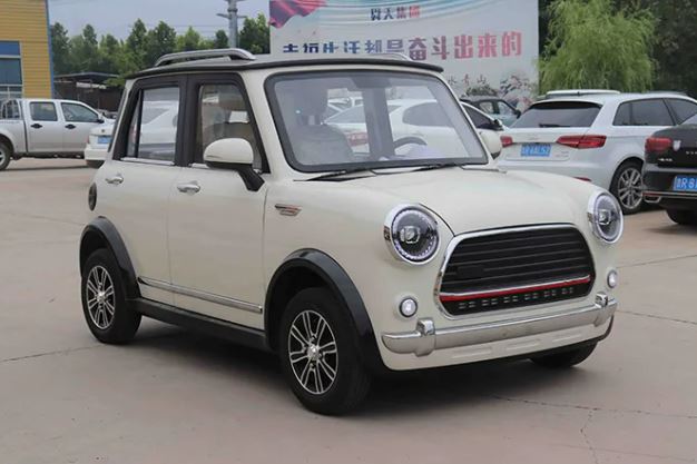 Cream-colored Shandong Keyu TC-T four-wheel electric car.