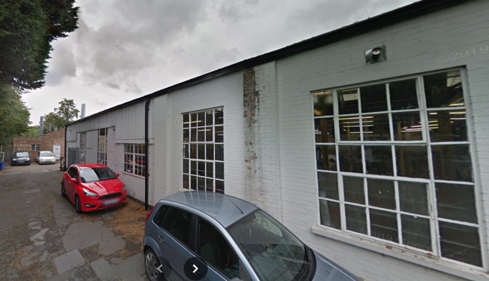 TC Harrison Ford St Neots building exterior with cars parked in front.