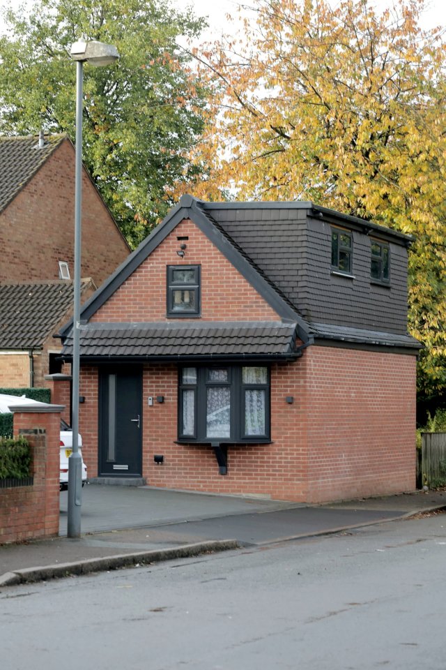A brick garage converted from a house.