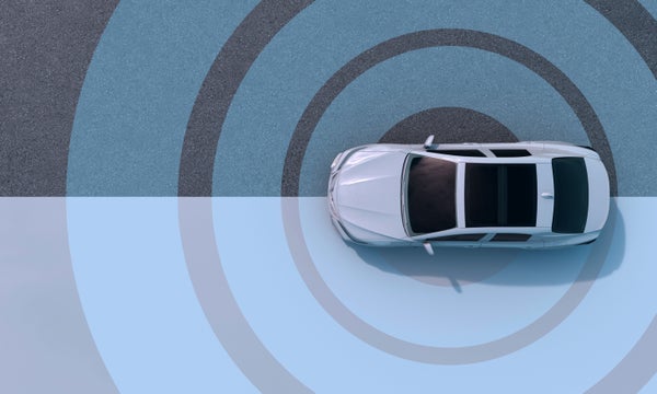 A car parked on the ground with a target design surrounding it