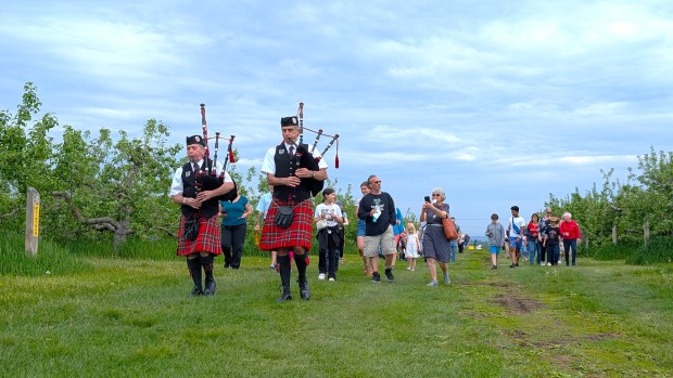 Two bagpipers led a parade of people to the butterfly release that took place during the 24th annual Apple Blossom Festival on May 17 at Sholan Farms in Leominster. (DANIELLE RAY/SENTINEL & ENTERPRISE)