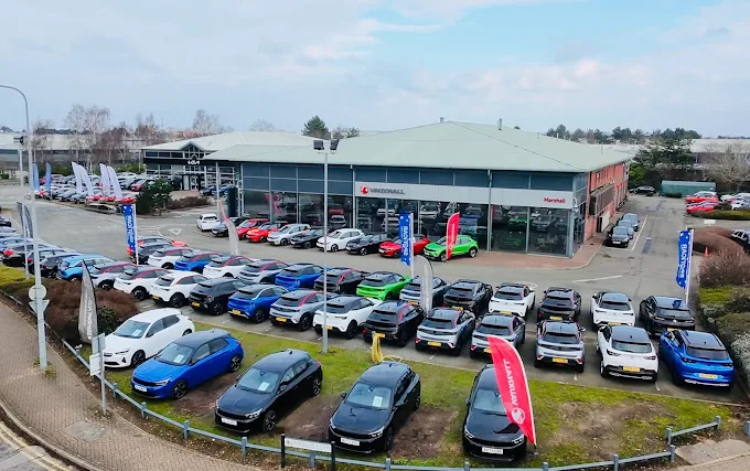 Marshall Vauxhall dealership in Ipswich with many cars on the lot.