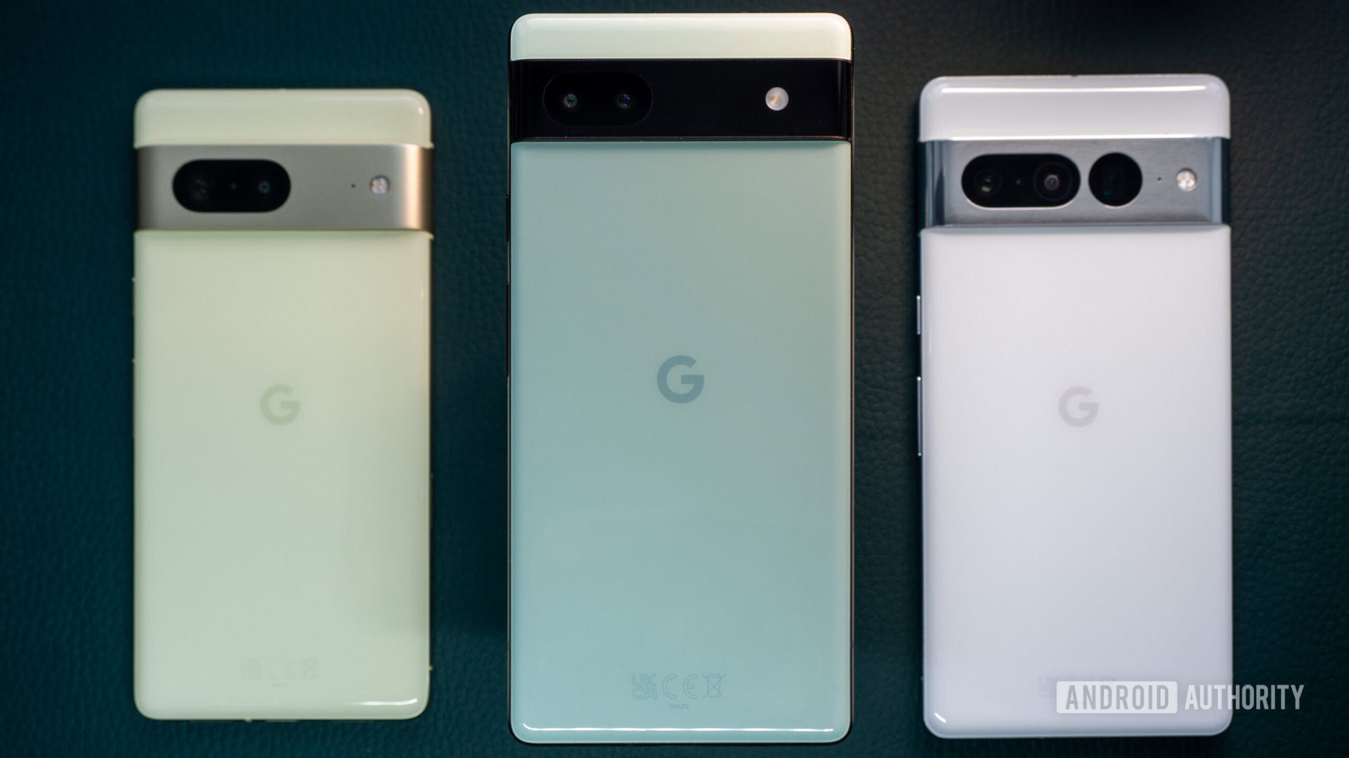 Green Google Pixel 6a in the foreground, with white Pixel 7 Pro and lime Pixel 7 in the background pixel 6a vs 7 vs 7 pro 2
