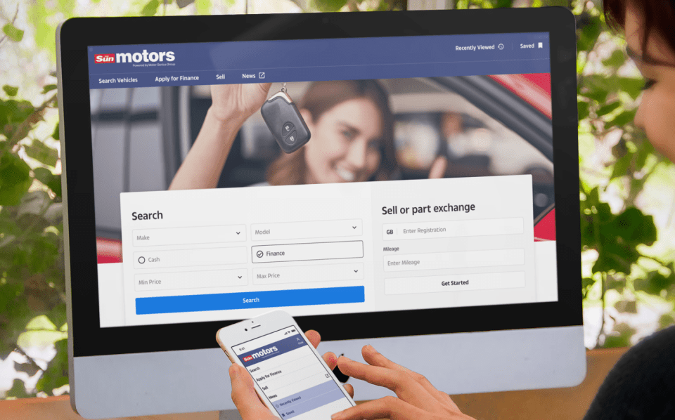 Person using Sun Motors website on computer and phone to search for vehicles.