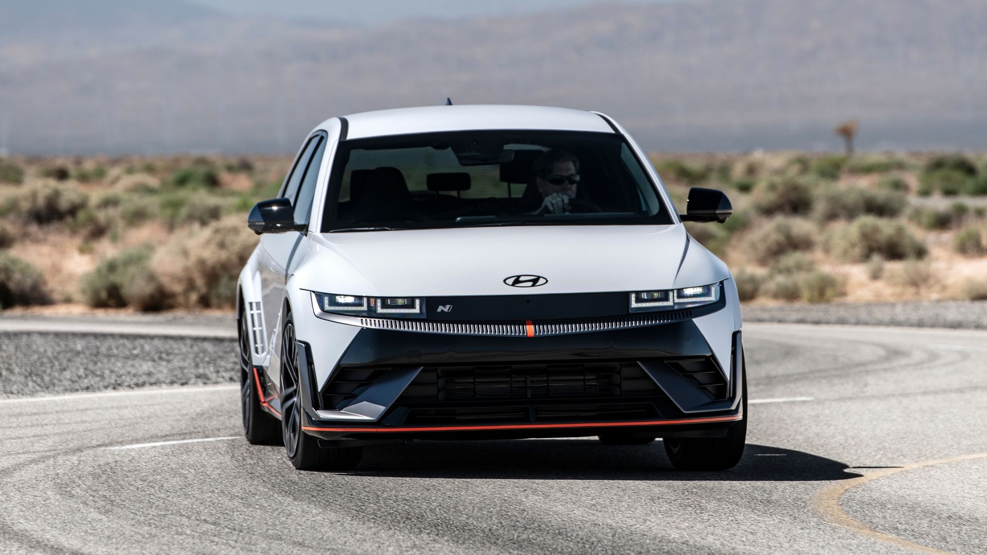 Front driving image of a white 2025 Hyundai Ioniq 5 N