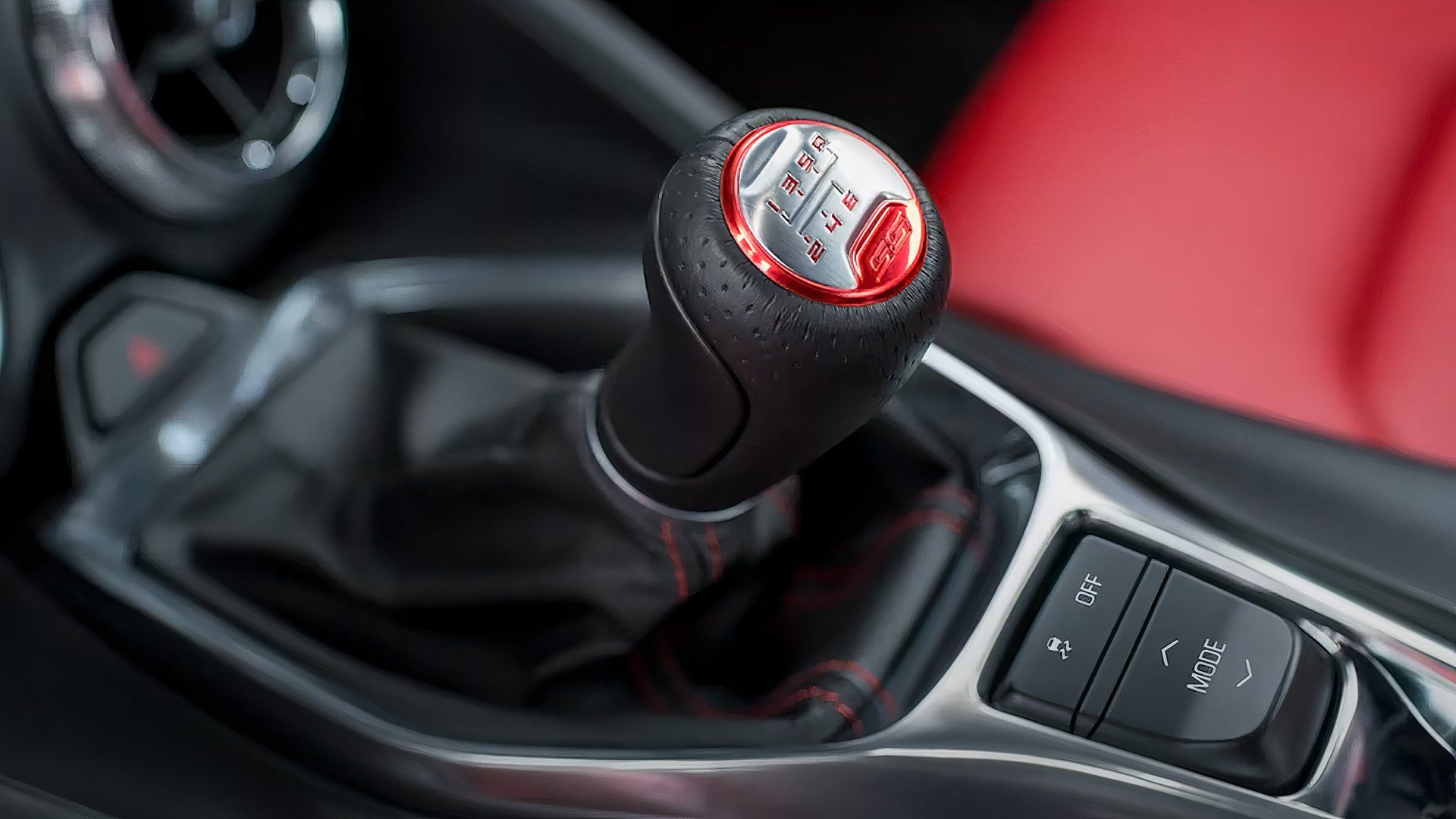 A 2024 Chevrolet Camaro in manual, stick-shift format